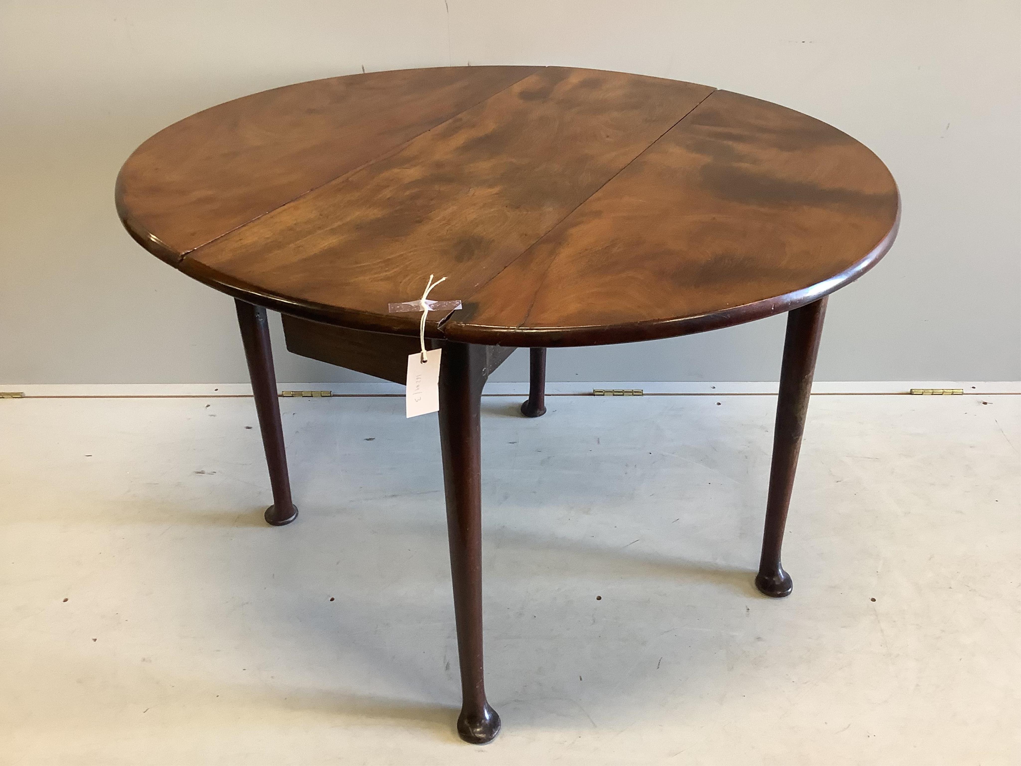 A small George III mahogany drop leaf pad foot table, width 103cm extended, depth 94cm, height 69cm. Condition - fair to good